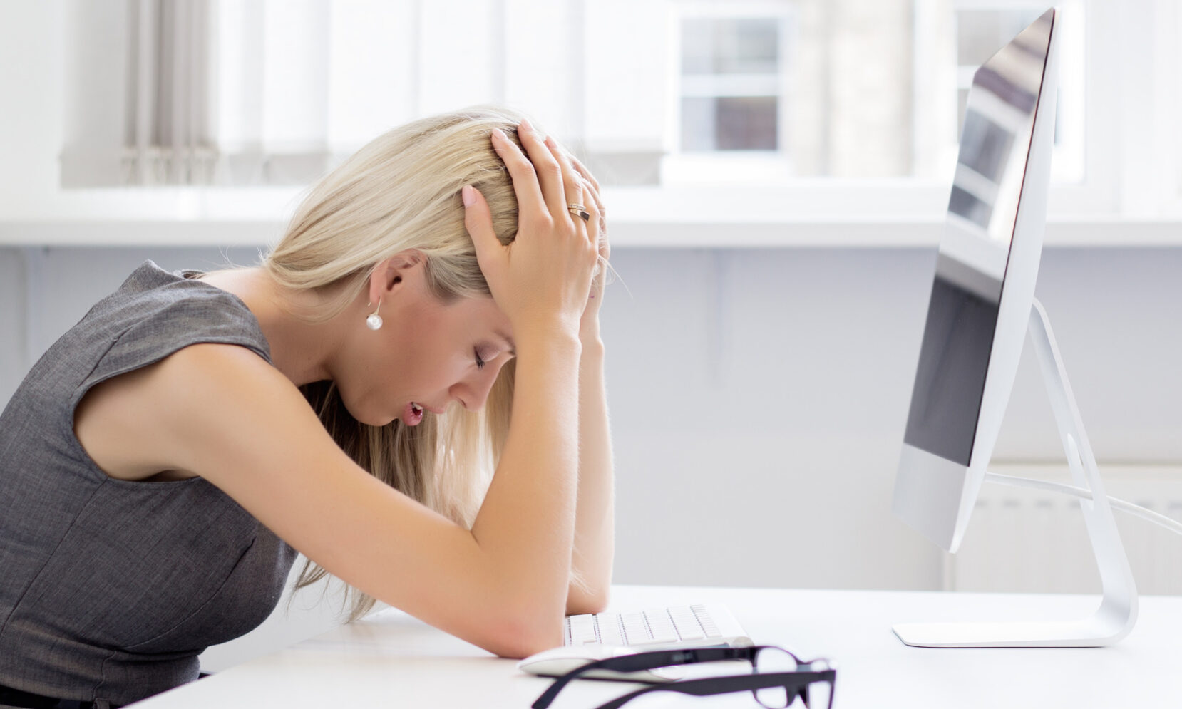 Overworked and tired young woman in front of computer Why Company Owners Should Go To Therapy | Private Therapy Clinic