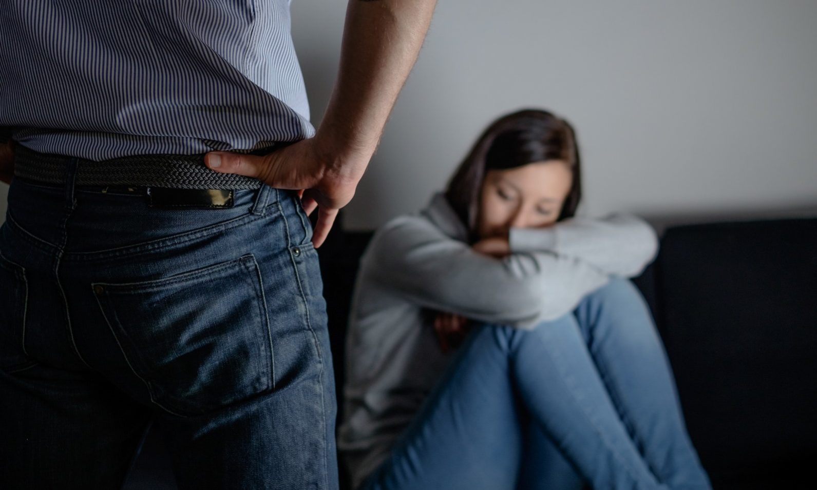Domestic violence and abuse of a man over young woman , the main subject in focus is the bad man. when your partner keeps putting you down