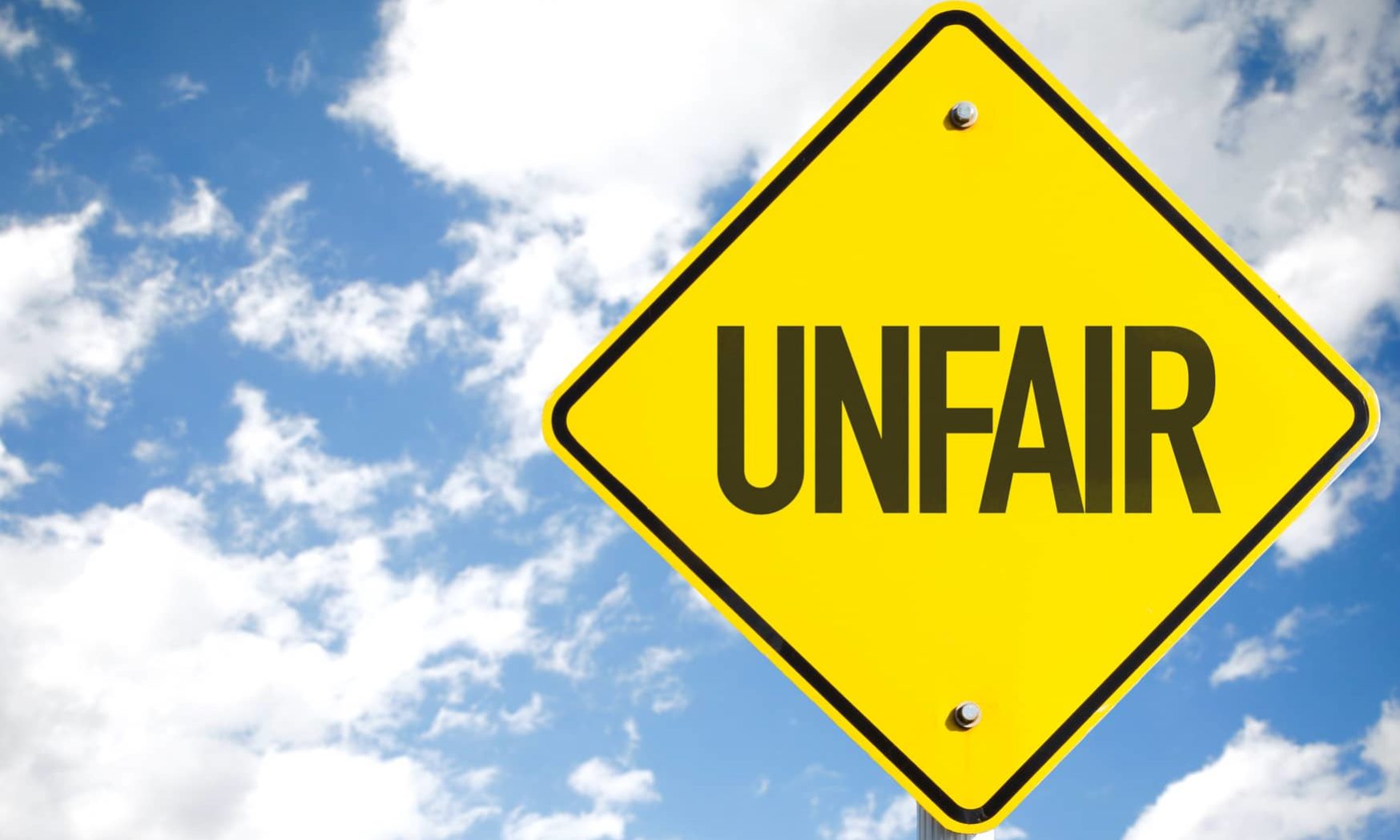 Unfair sign with sky background Unconscious Bias